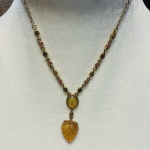 Unique piece. Gold toned with crystal accents.